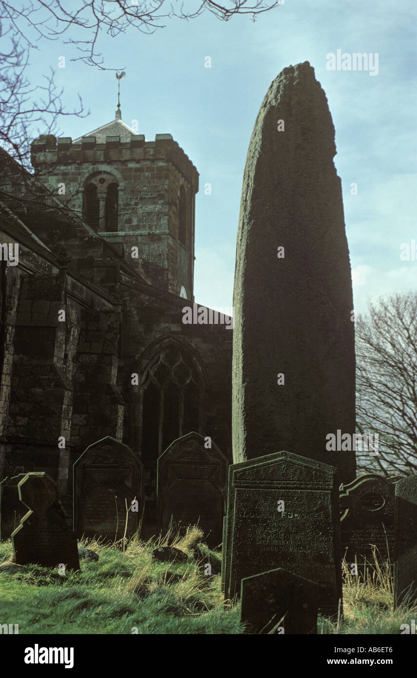 The tallest standing stone in Britain rises 25 feet 4 inches from the churchyard of All Saints Church Rudston in East Yorkshire Stock Photo
