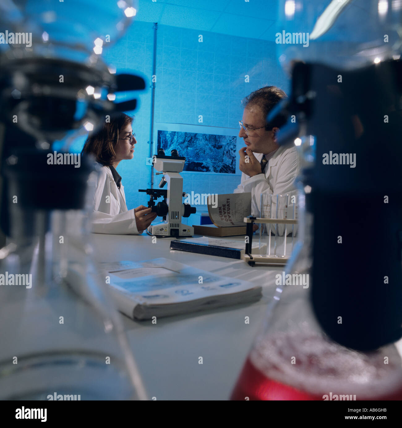 Laboratory technicians in discussion at water treatment plant, Izmit, Turkey, Stock Photo