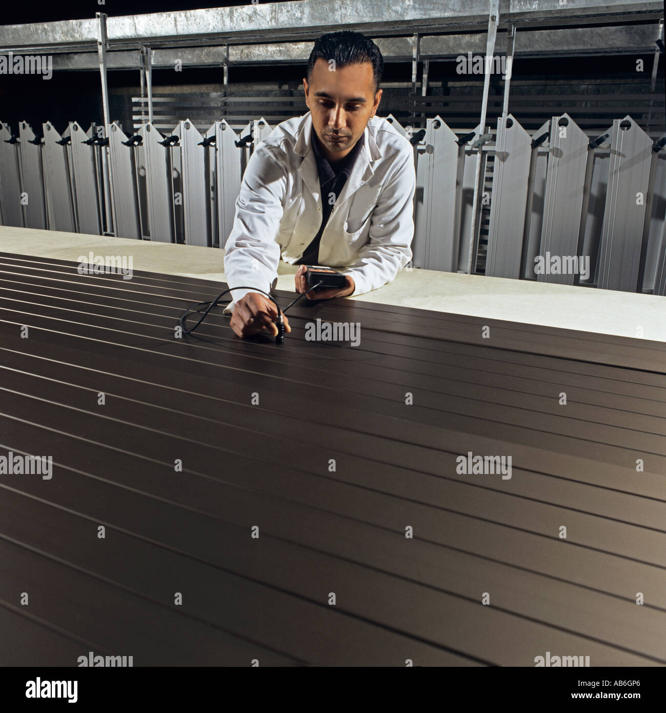 Quality control following powder coating of aluminium extrusions for