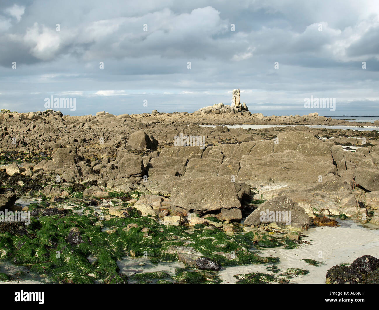 low tide stony strand with granit rocks at the coast near by Kerlouan ...