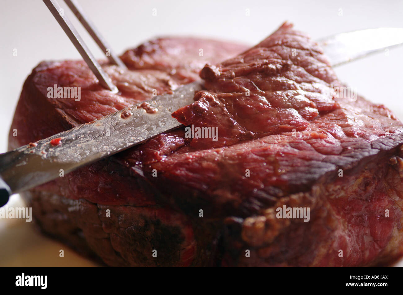Carving Roast Beef Joint Stock Photo Alamy