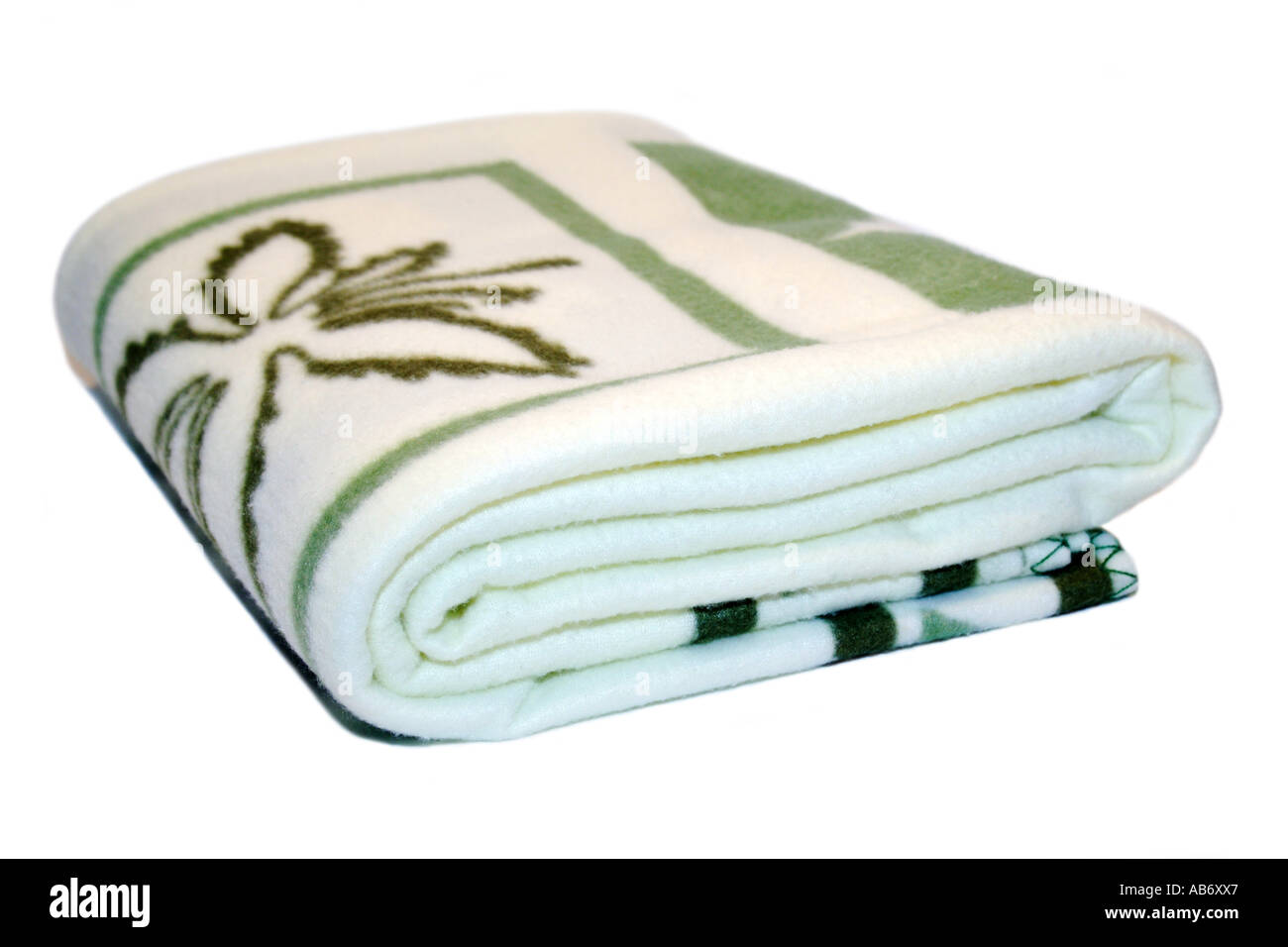 A Soft wool Green and white patterned Blanket. Stock Photo