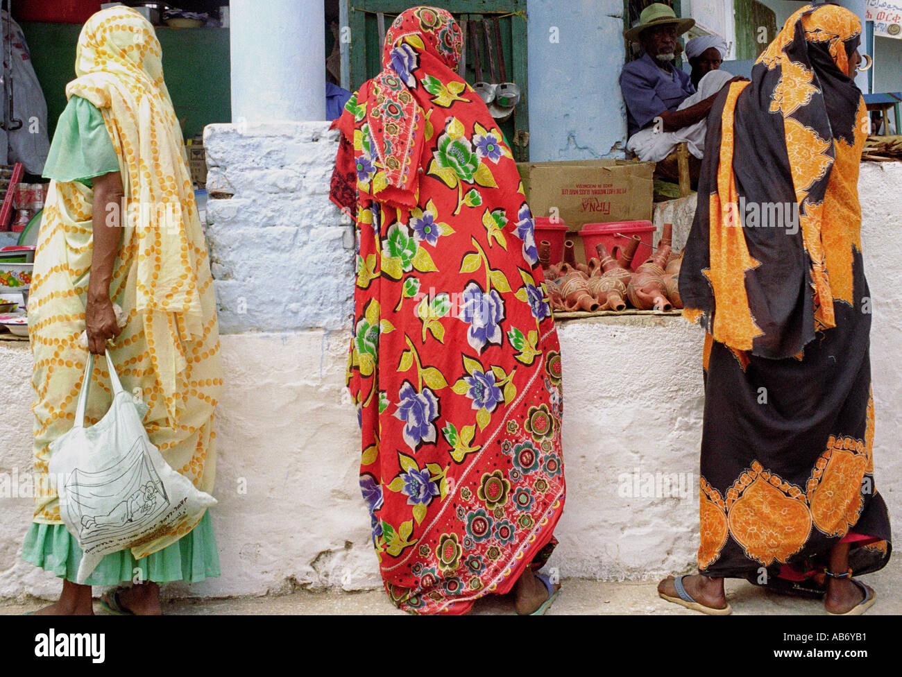 Three women in colourful robes shopping at the market in Keren Eritrea  Stock Photo - Alamy