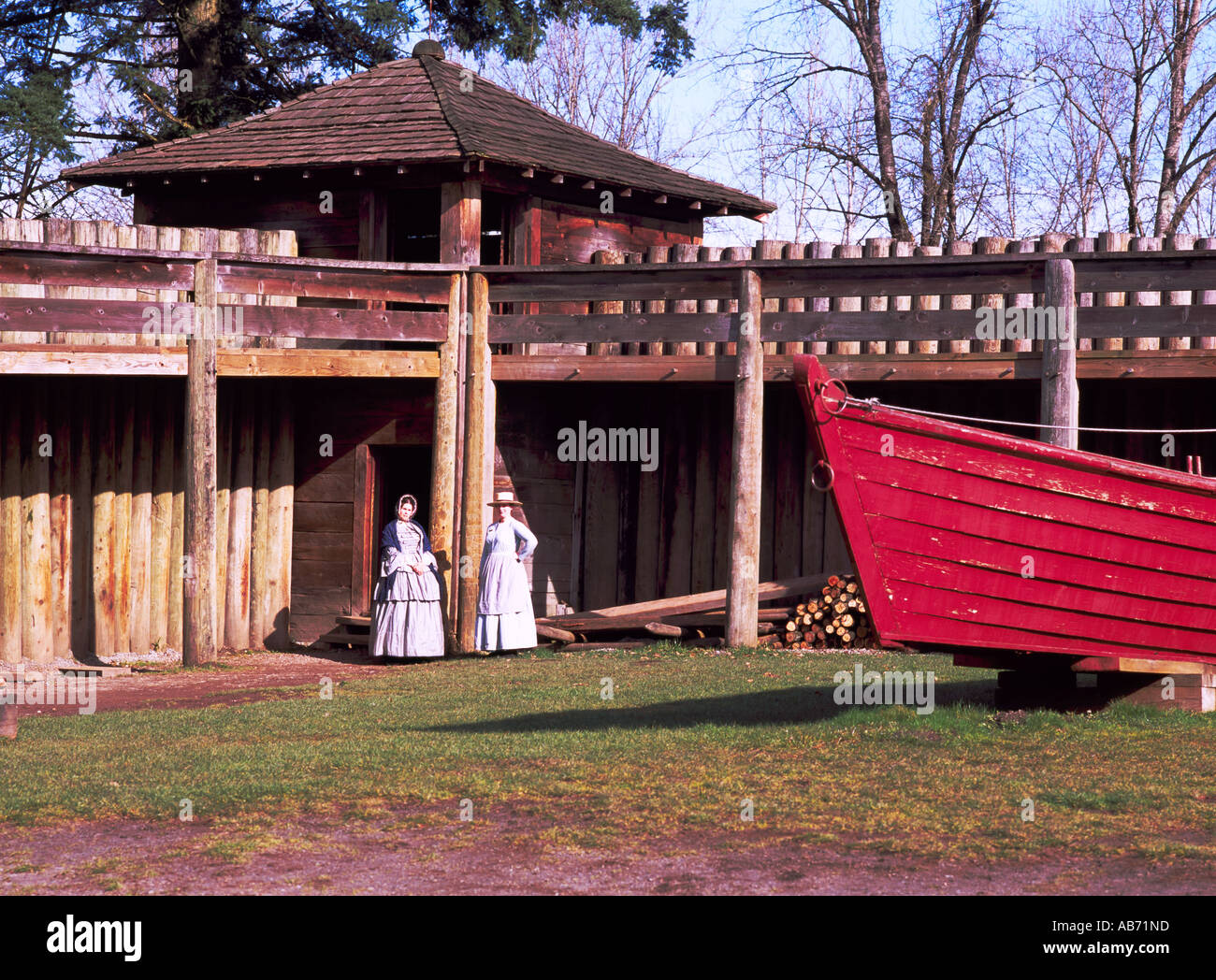 Re-enactors posing at a Bastion and a Supply Bateau at Fort Langley in the Fraser Valley of Southwestern British Columbia Canada Stock Photo