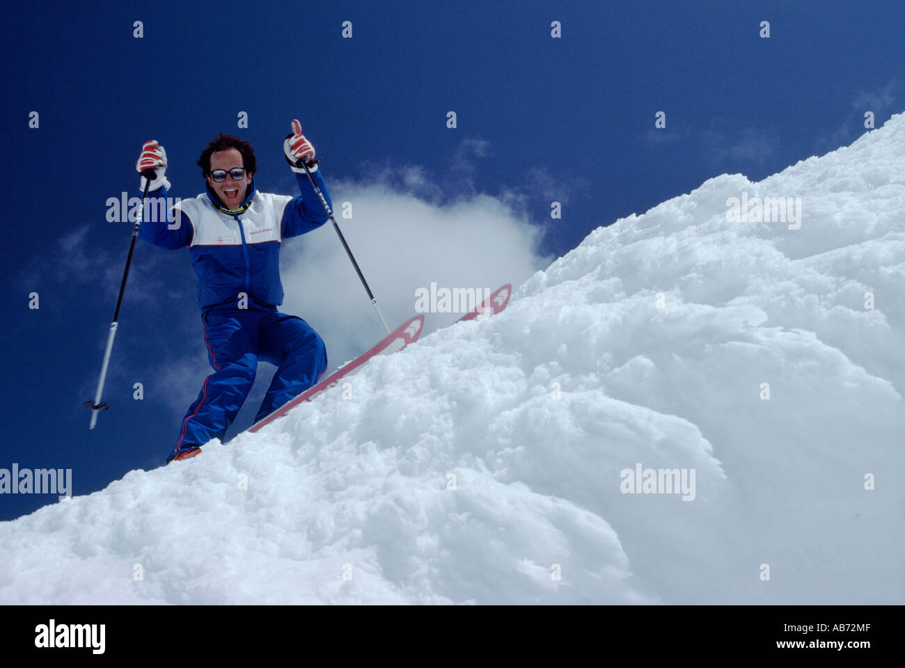 Skier going down steep slope hi-res stock photography and images - Alamy