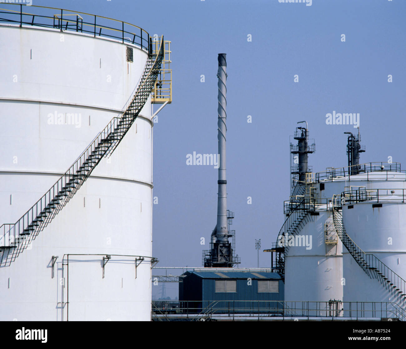 Smoke stack and storage tanks at a petrochemical works, Billingham, Teesside, Cleveland, England, UK. Stock Photo