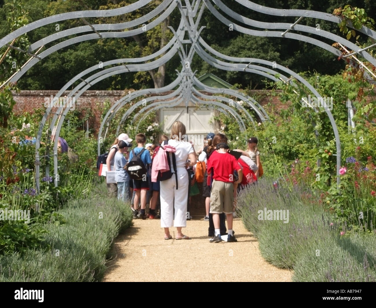 School children & teacher walled garden Osborne House former royal residence of Queen Victoria & Prince Albert in East Cowes Isle of Wight England uk Stock Photo