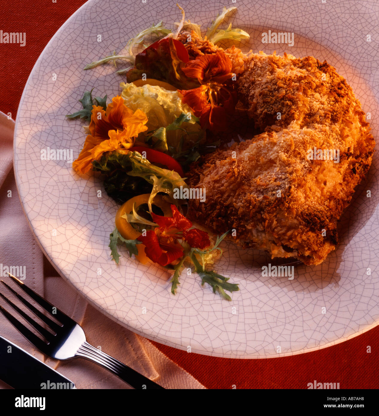 Fried chicken with nasturtium salad Stock Photo