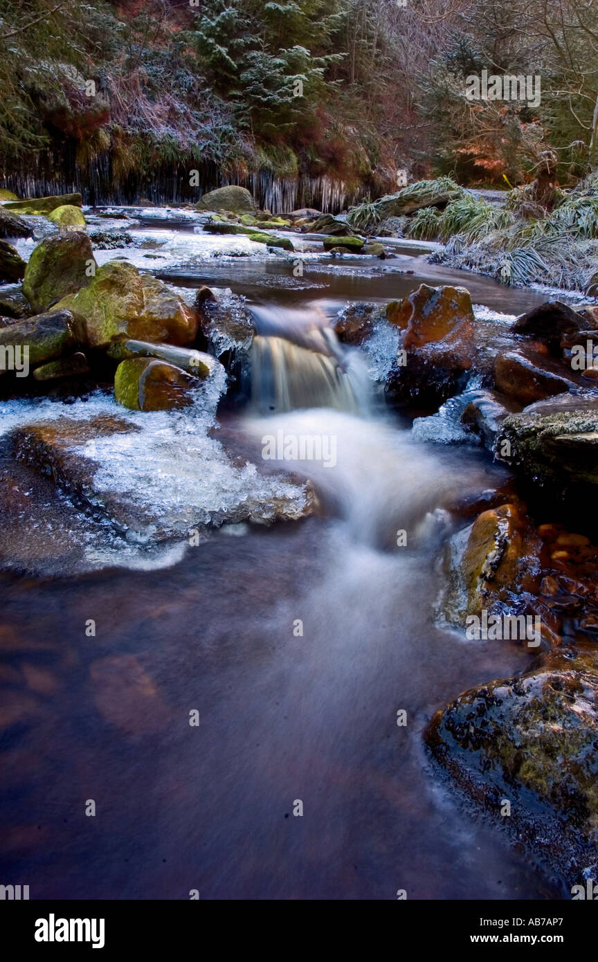Frozen river with waterfall and icicles,Hamsterley,northern england, Stock Photo