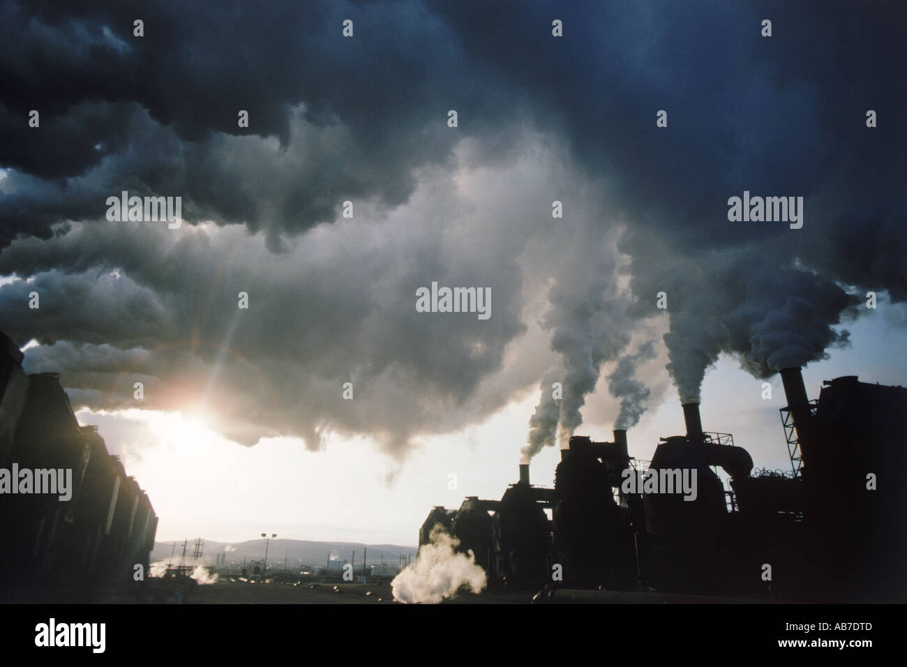 Oil Refinery Emitting Air Pollution at sunrise near Santa Rosa, California Stock Photo