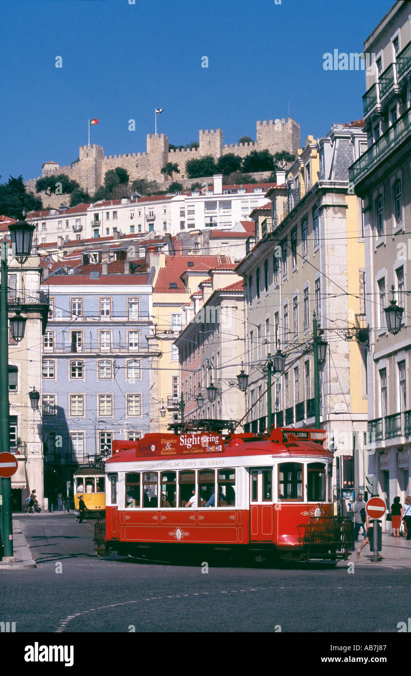 Tram in street of Lisbon below the Castle of St Jorge. To see 66 more images click below the thumbnail. Stock Photo
