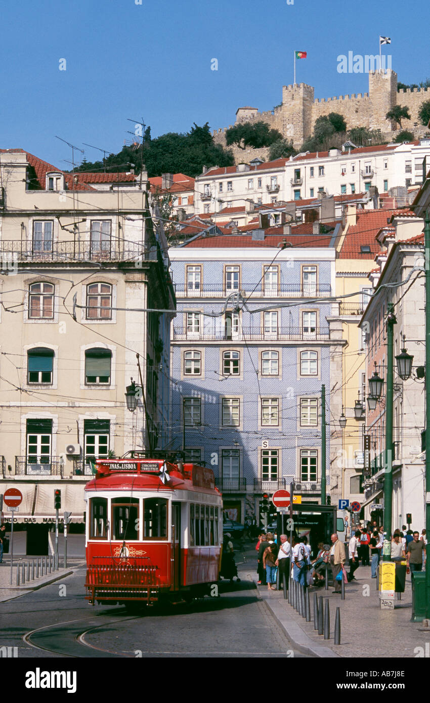 Tram in street of Lisbon below the Castle of St Jorge. To see 67 more images click below the thumbnail Stock Photo