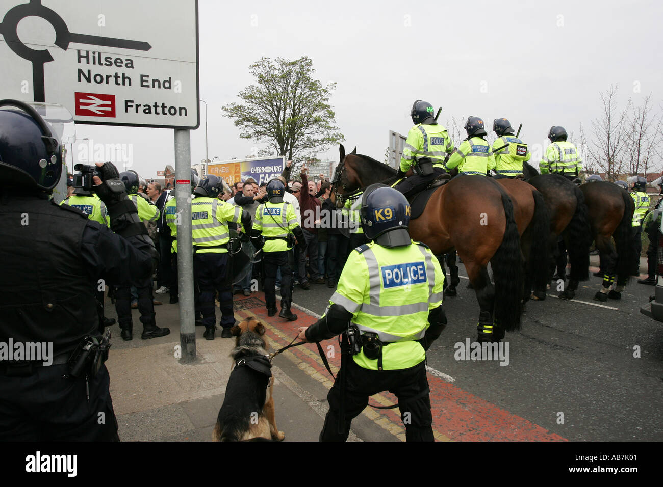 riot police keeping football fans under control in Portsmouth Hampshire