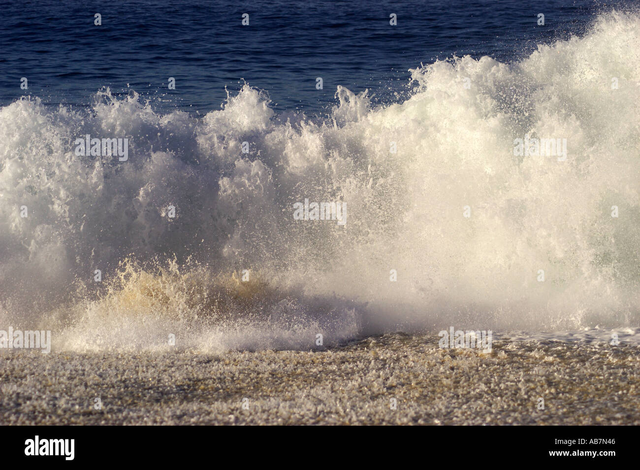 breaking shore break wave Stock Photo