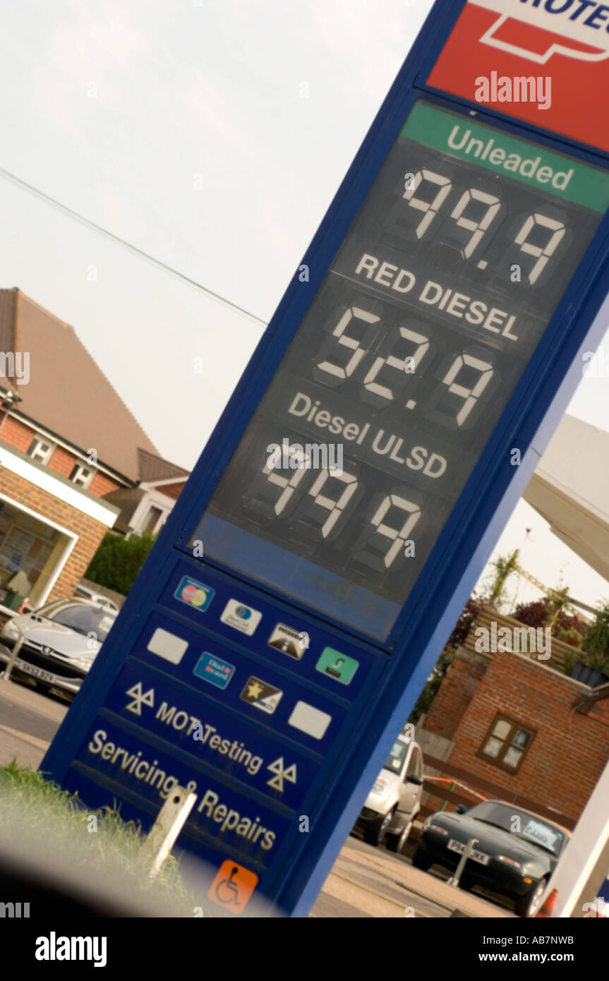 Petrol price board, unleaded petrol at 99.9 p per litre. just under £1