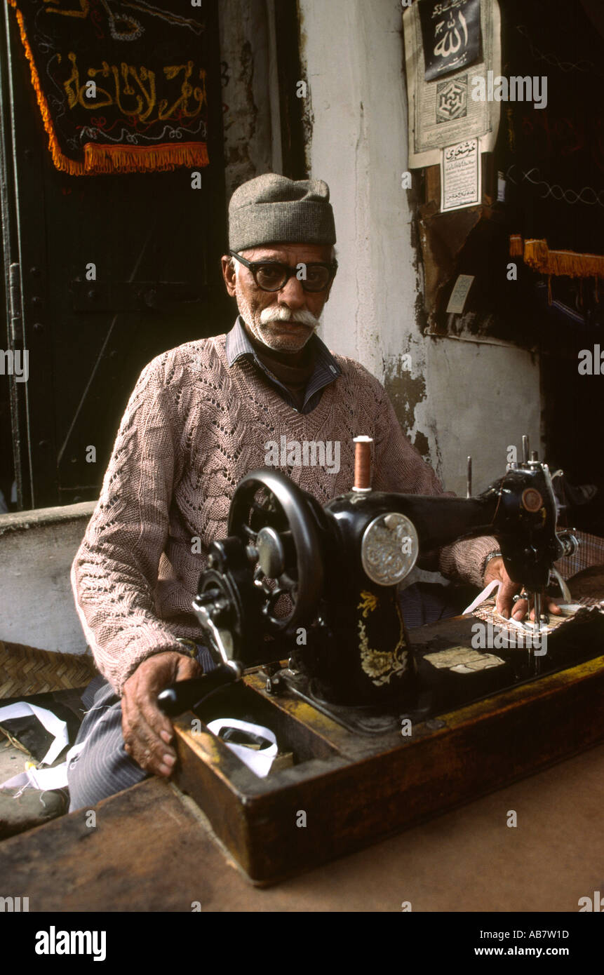 Pakistan Rawalpindi Tailor at his Sewing machine in Rajah Bazaar Stock