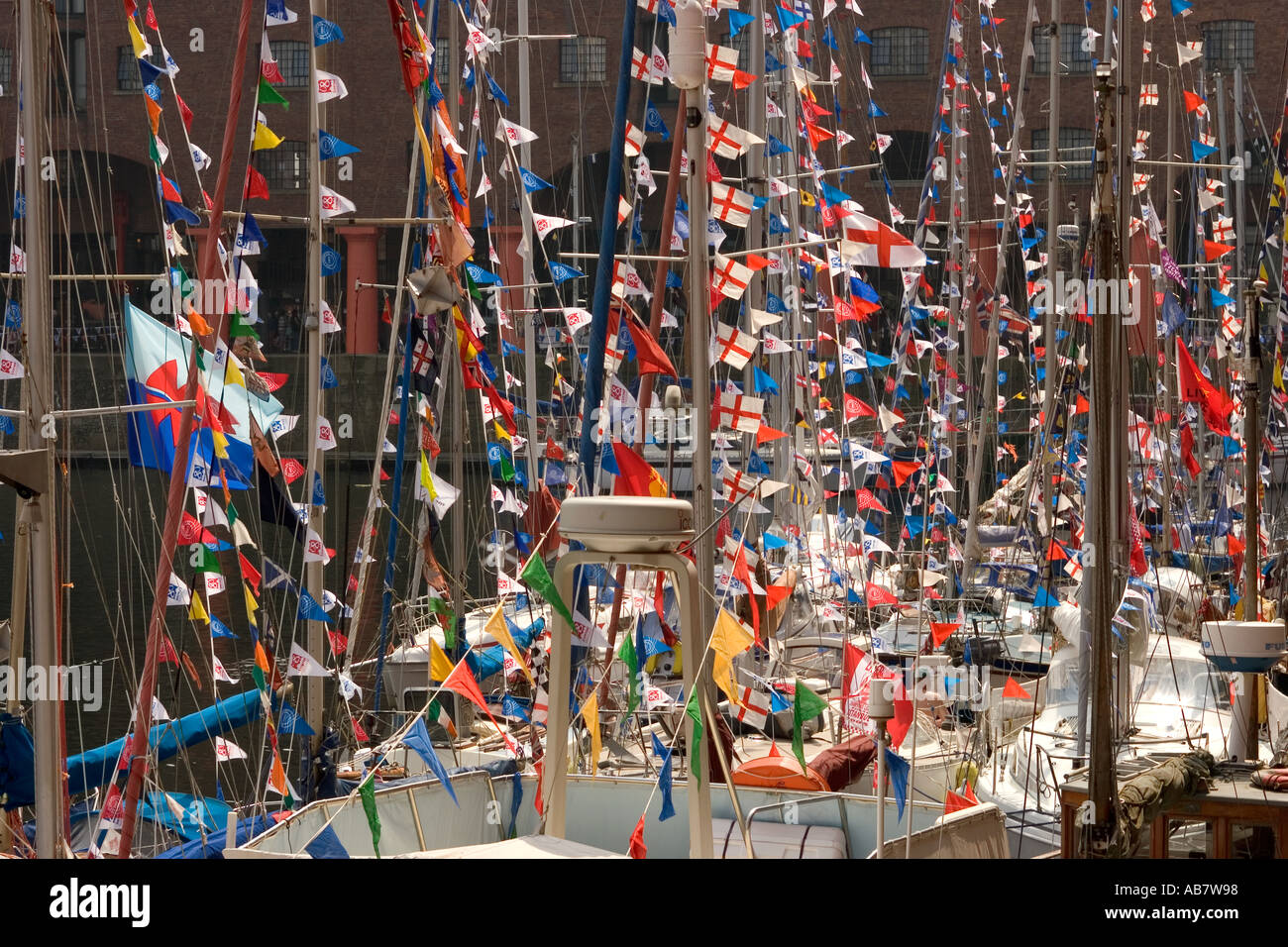 UK, Merseyside Liverpool Mersey River Festival flags and bunting decorating boats in Albert Dock Stock Photo
