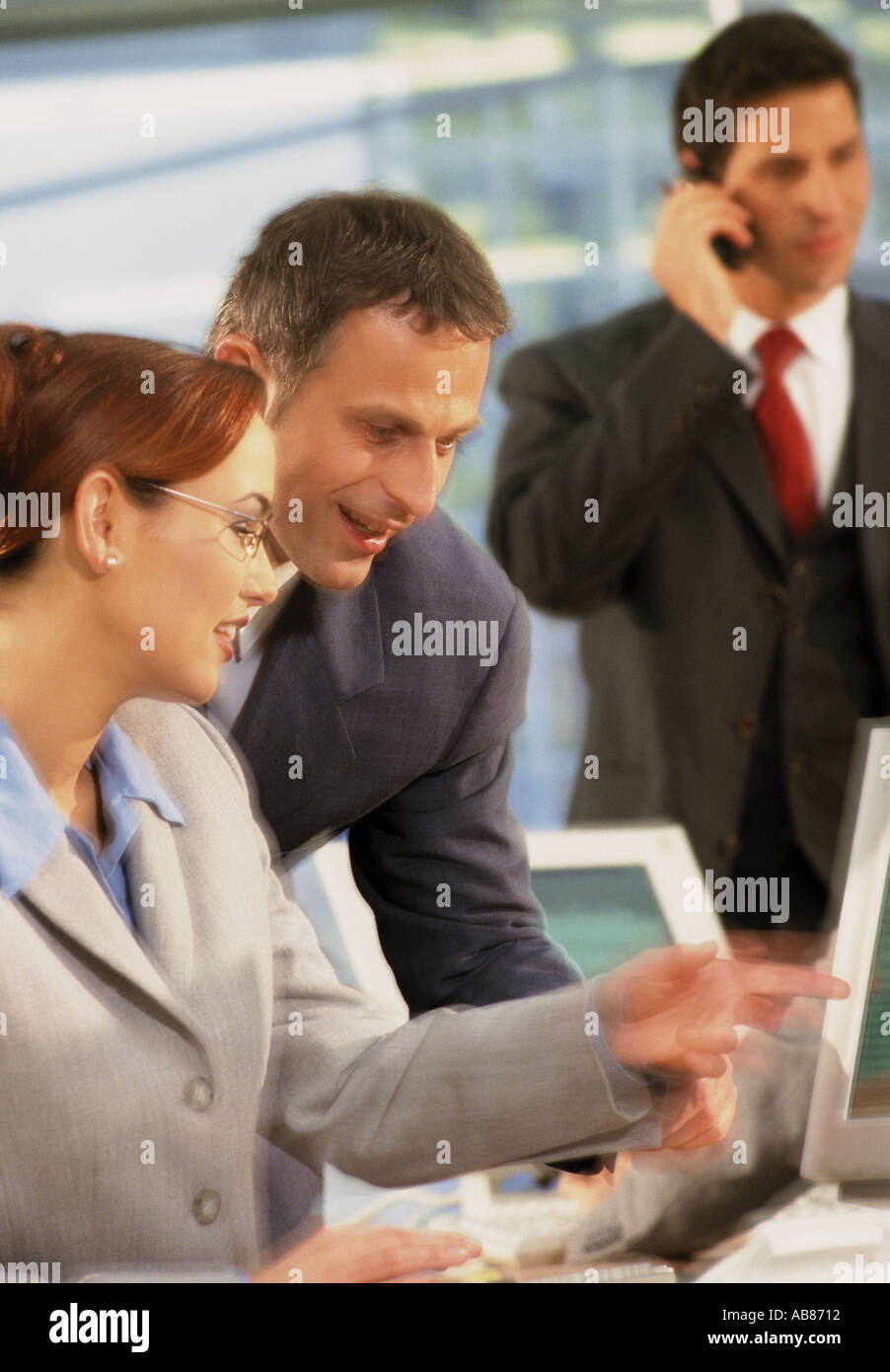 Business people at computer Stock Photo - Alamy