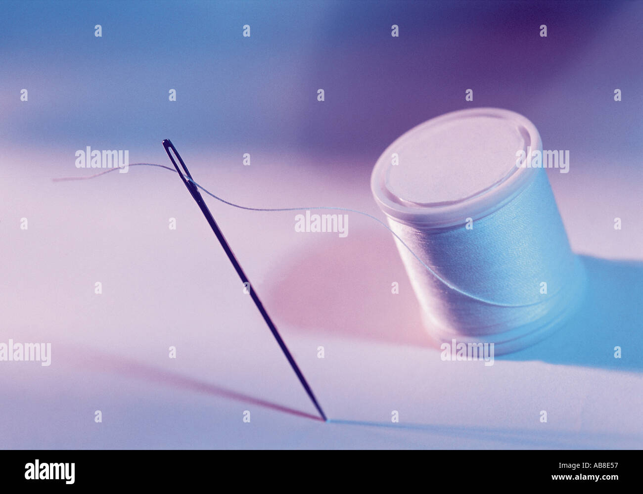 Needle and thread Stock Photo - Alamy
