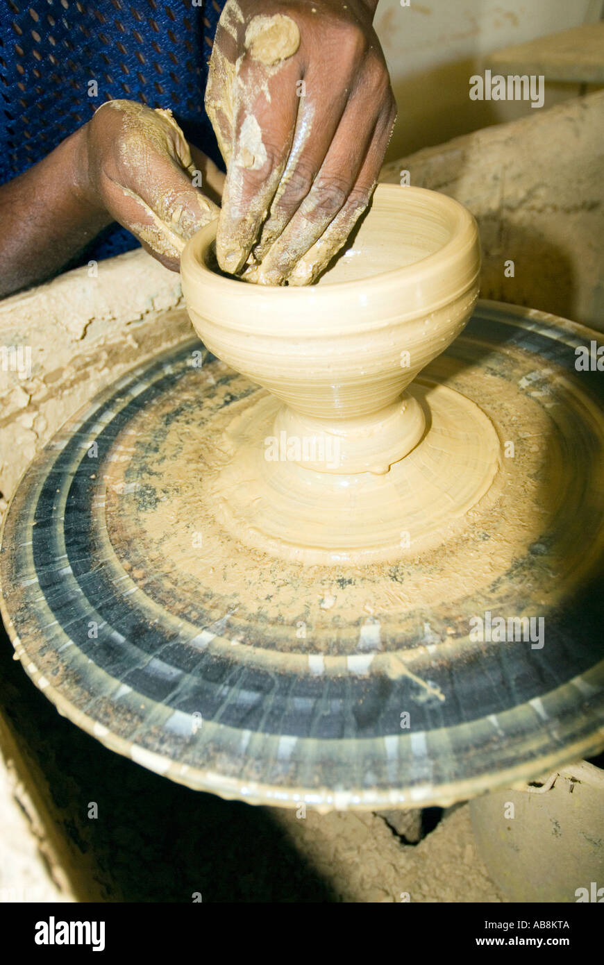 West Indies Trinidad Port of Spain Radikas Clay Pottery Shop Artist forming clay cup on Pottery wheel Stock Photo