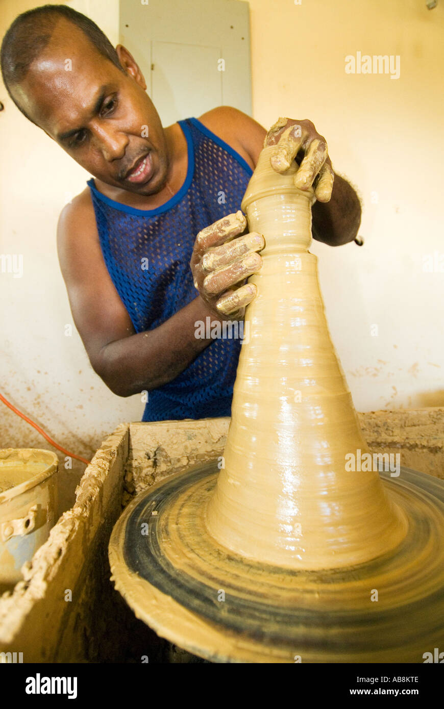 West Indies Trinidad Port of Spain Radikas Clay Pottery Shop Potter forming clay cup on Pottery wheel Stock Photo