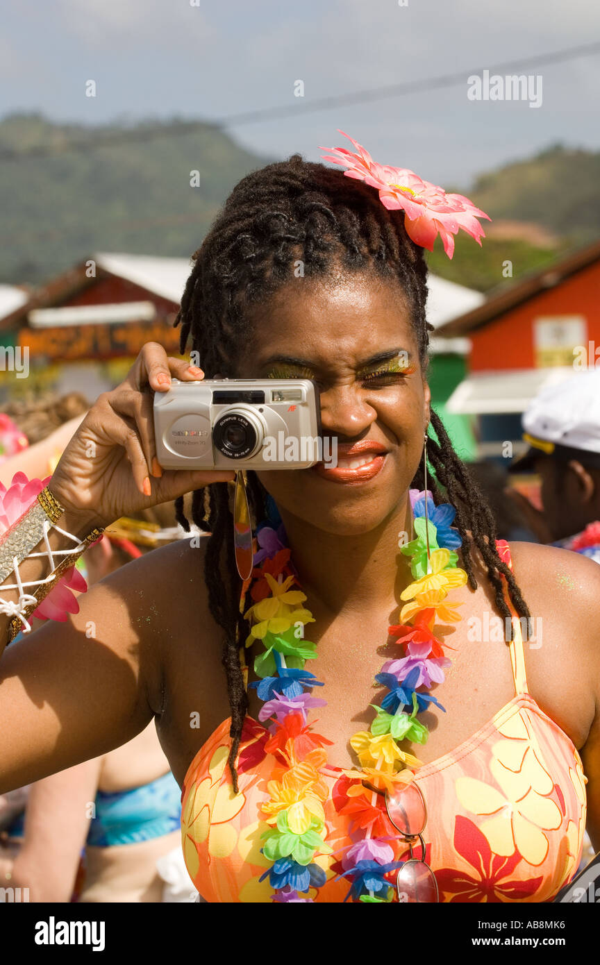 WEST INDIES TRINIDAD TOBAGO Port of Spain Carnival 2006 Woman taking picture of people at Carnival Parade. Stock Photo