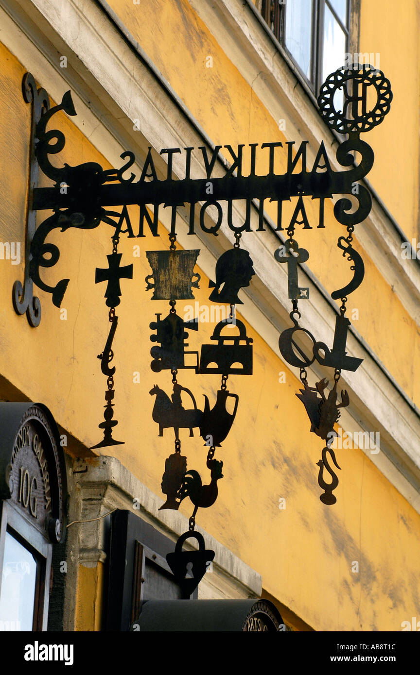 Medieval wrought iron shop sign of an antique store in Castle district Buda Budapest Hungary Stock Photo