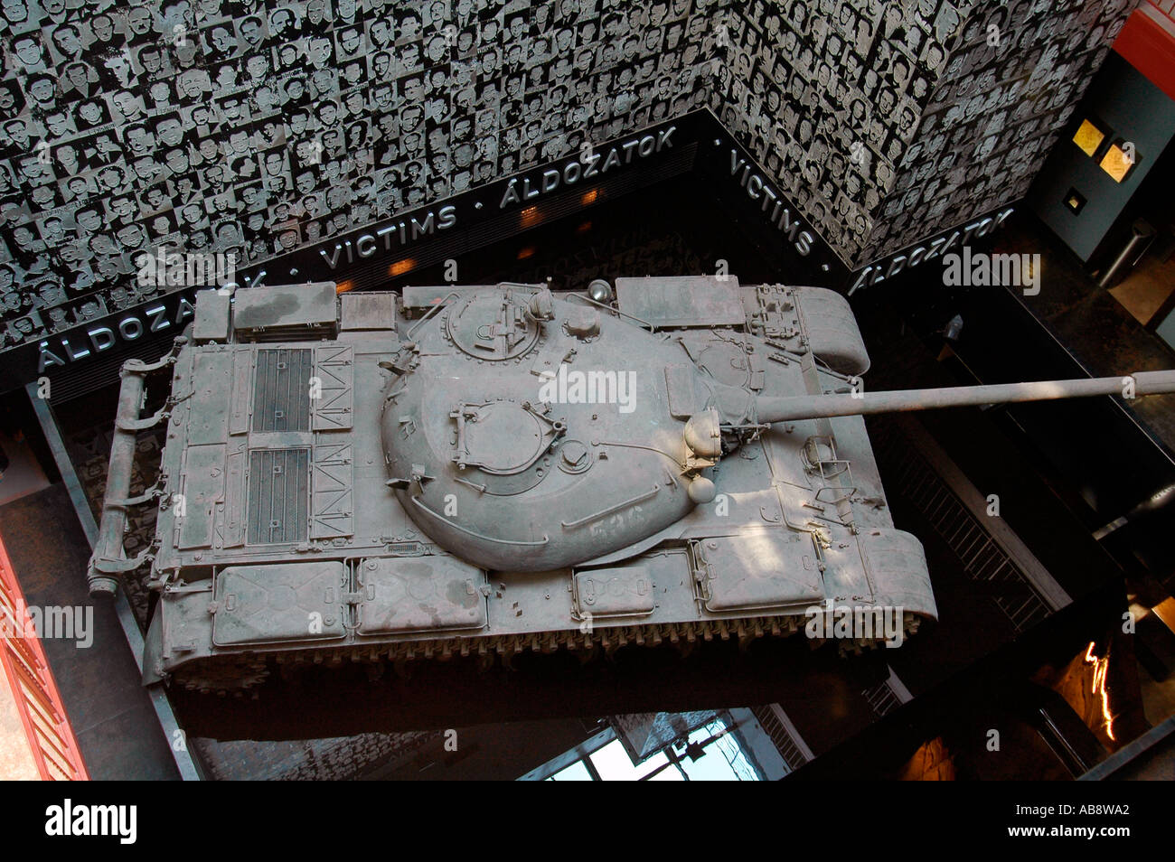 T-54 tank with installation of photos featuring victims of Hungarian Communist regime displayed inside House of Terror Haza Museum in Budapest Hungary Stock Photo