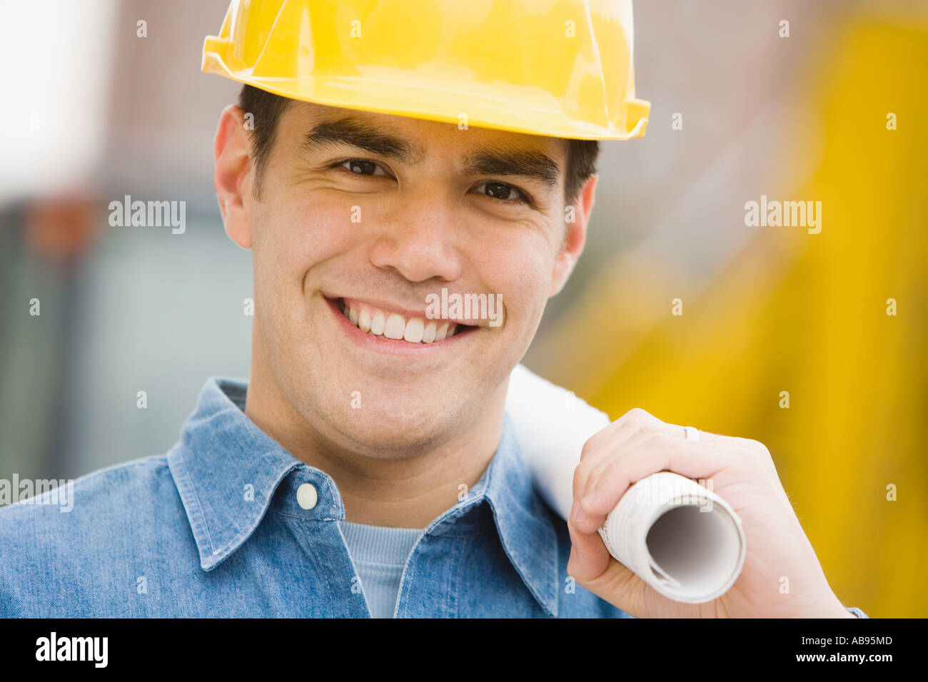 Manual worker holding blueprints Stock Photo