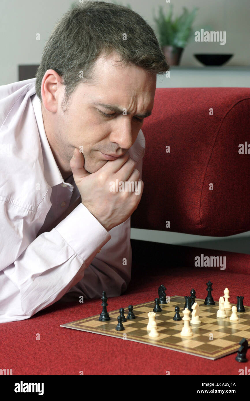 thoughtful man playing chess. Stock Photo