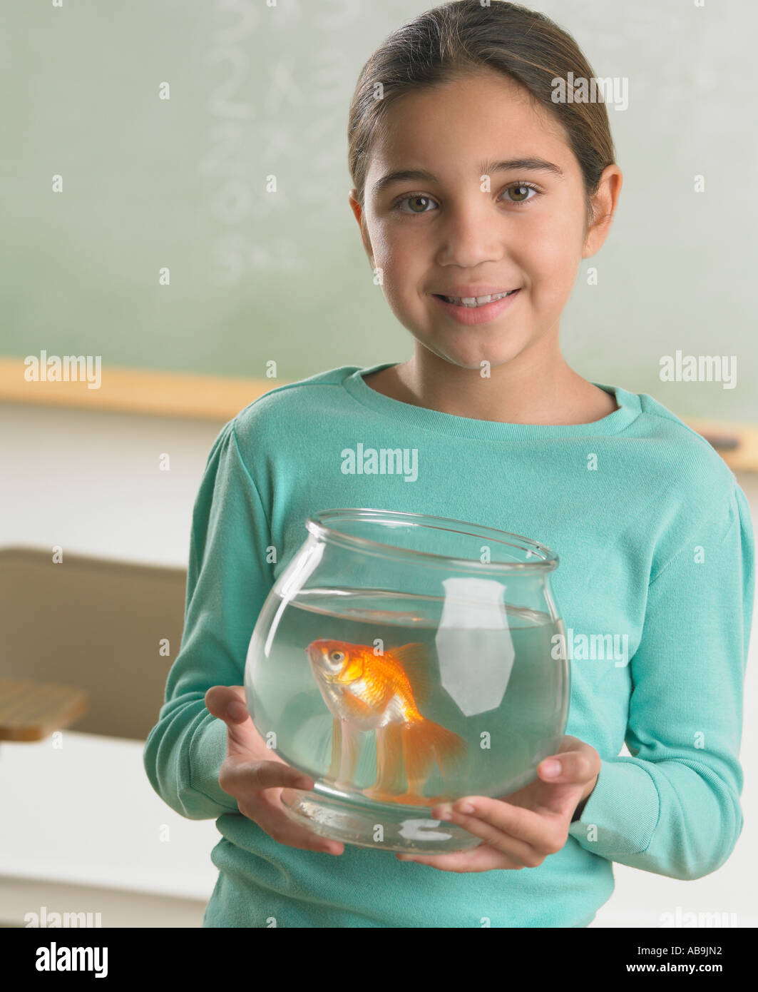Young girl holding a fishbowl Stock Photo Alamy