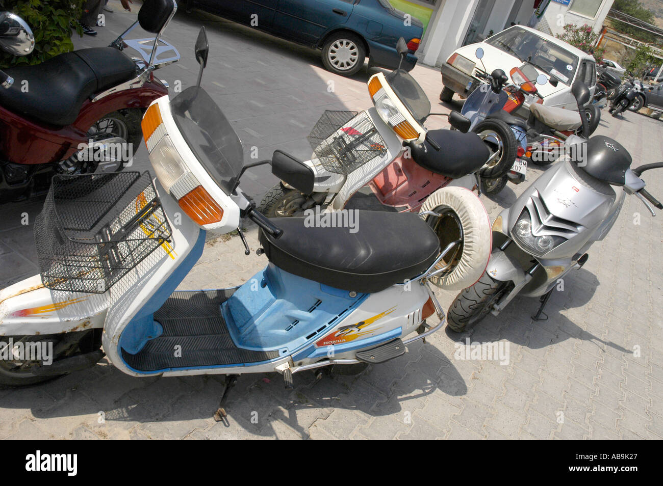 scooters and small motorcycles parked on the streets of Bodrum in