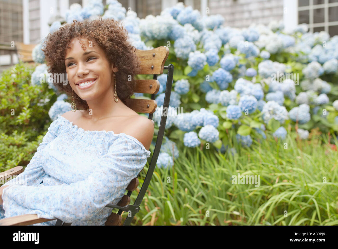 Young woman relaxing in a lawn chair Stock Photo - Alamy
