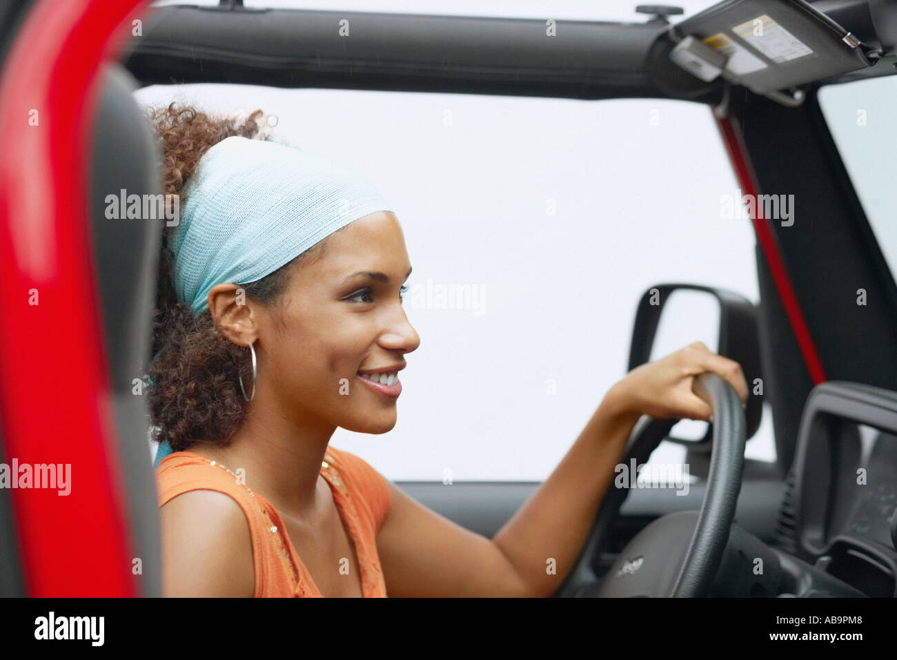 Young woman driving a Jeep Stock Photo