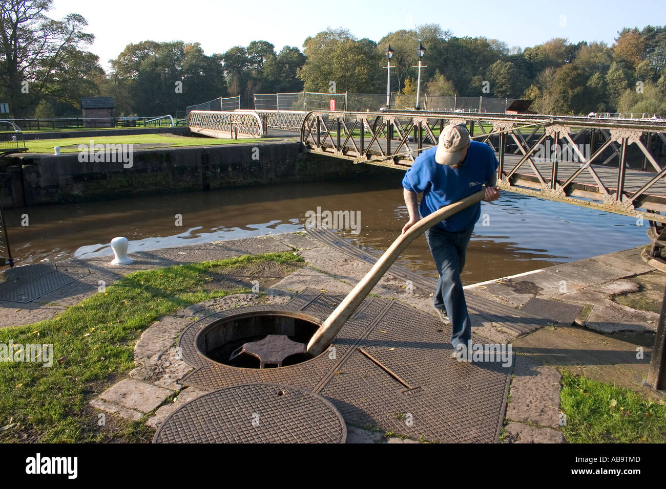 Lock keeper operating the water flow control at Vale Royal locks on the ...