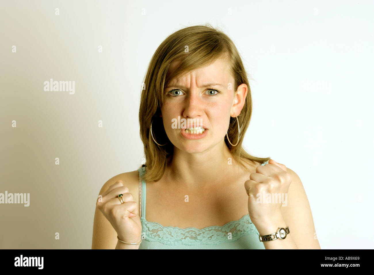 Frustration anger stress annoyance etc  Expressions from a young woman green  with envy envious Stock Photo
