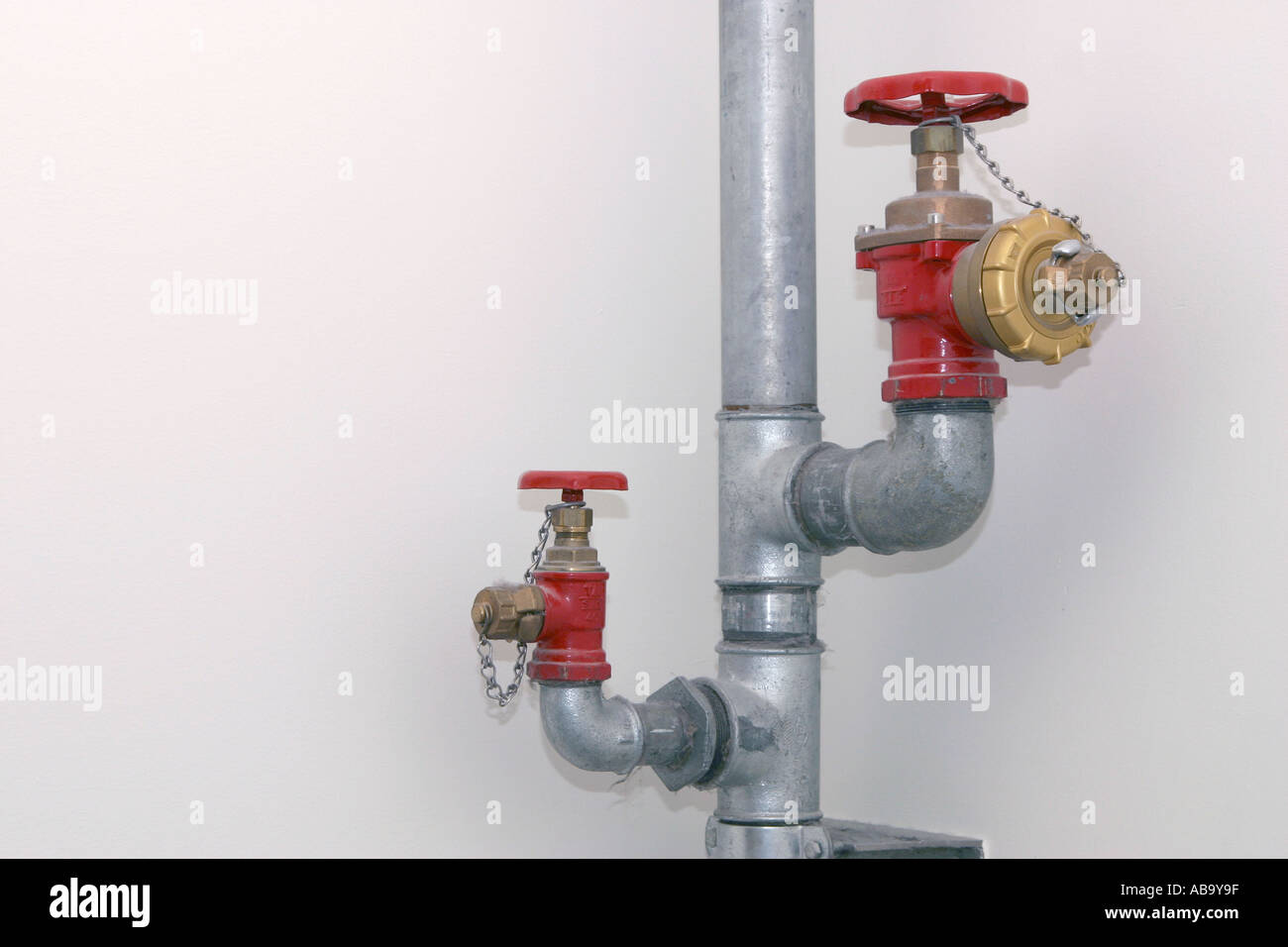 Water pipes with taps Stock Photo Alamy