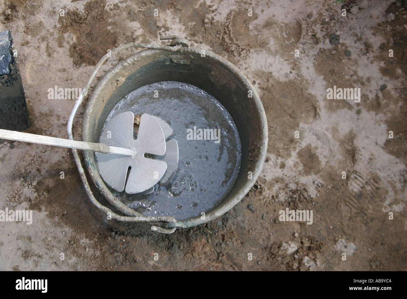 Mixing tool for concrete in a bucket Stock Photo Alamy