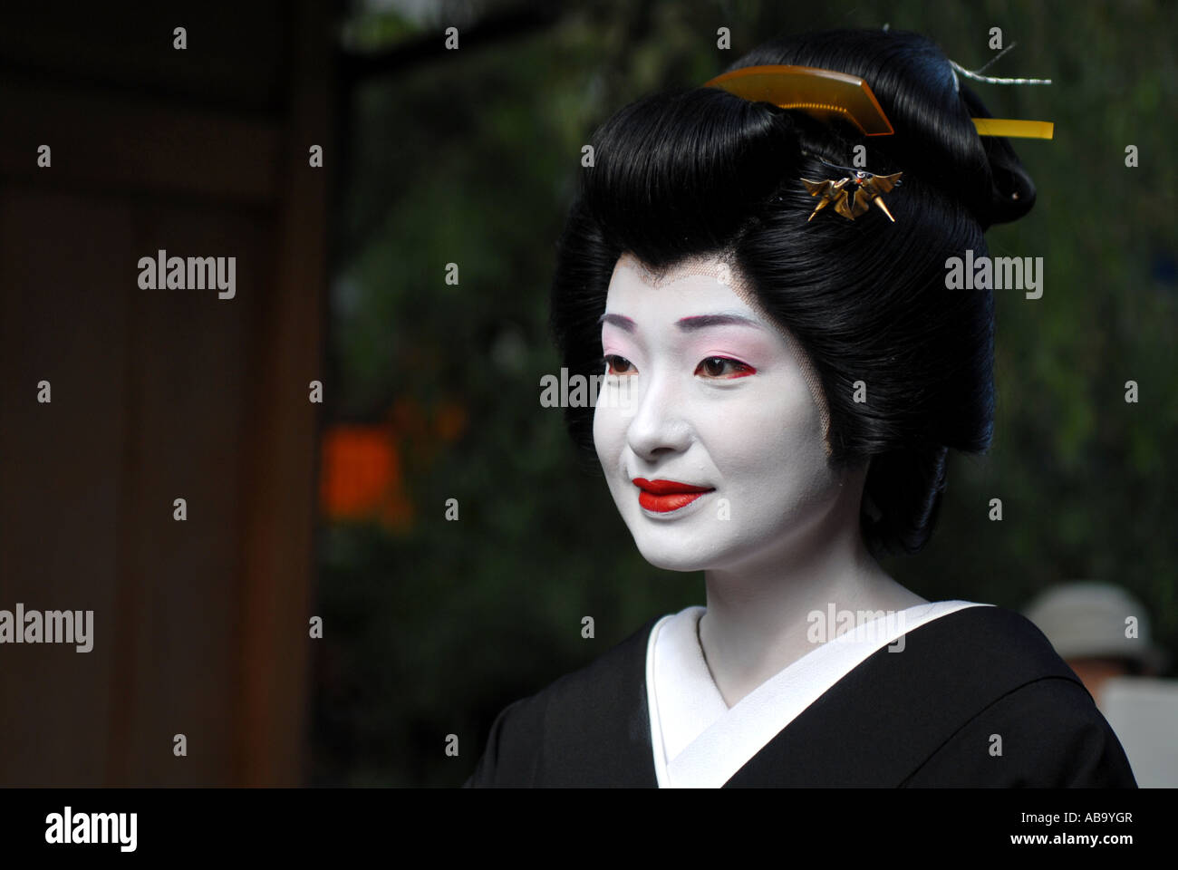 A Maiko (trainee geisha) in the Gion district of Kyoto Stock Photo