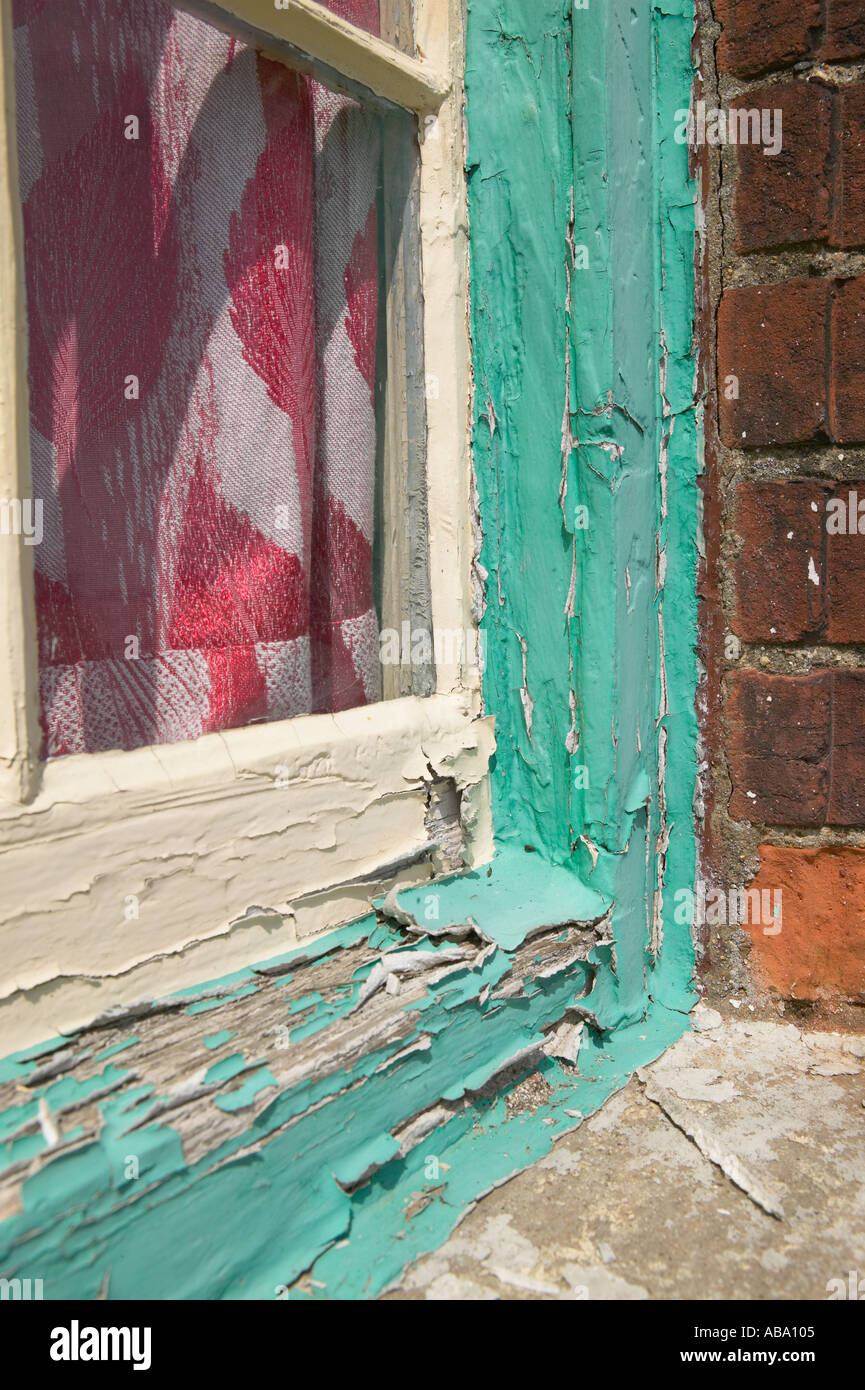 paint peeling around wooden window frame vertical Stock Photo Alamy