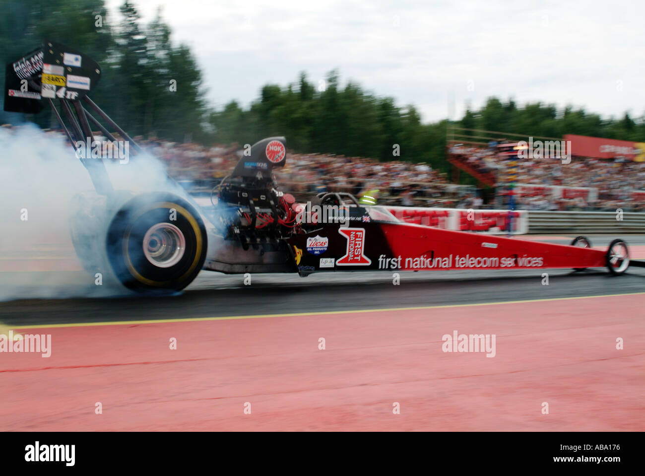 Andy Carter burns out in his Top Fuel dragster at Mantrop Park dragstrip in sweden Adrenaline rush extreme risk danger supercha Stock Photo