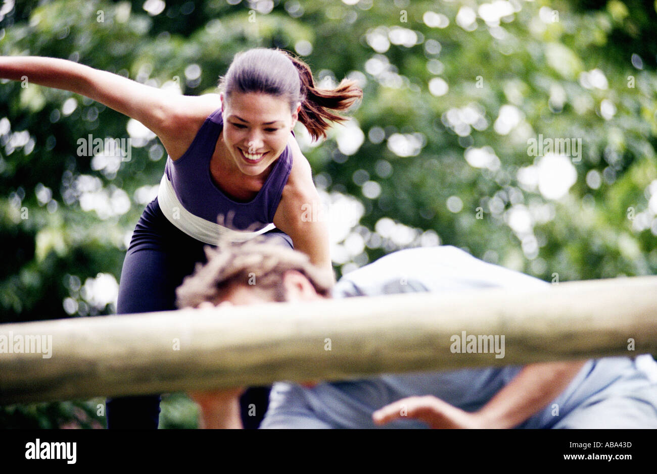 Couple on obstacle course Stock Photo