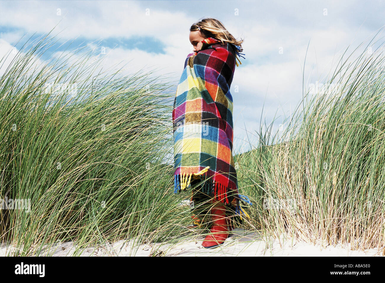 Girl wrapped in a blanket Stock Photo Alamy