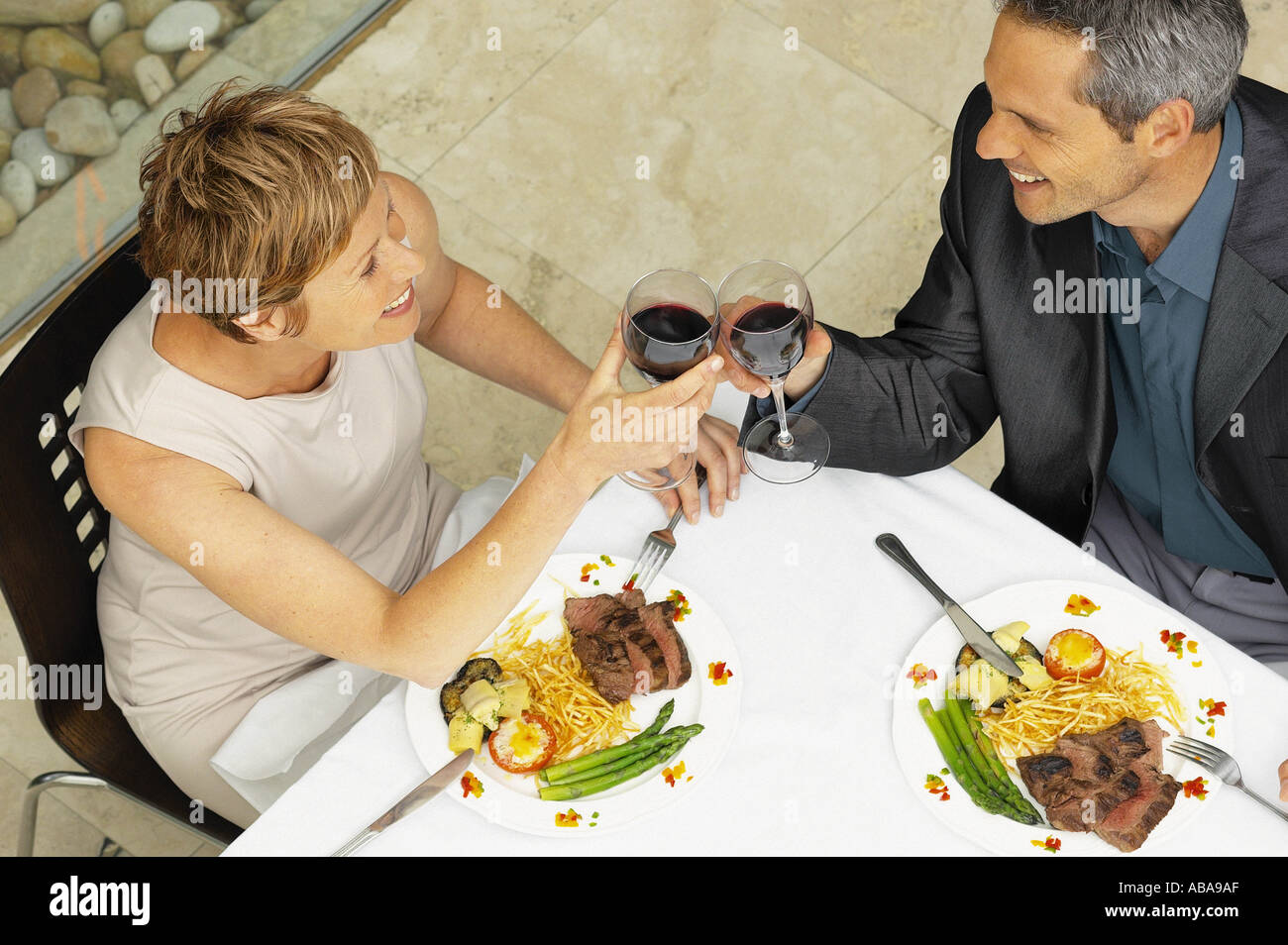 Man and woman having a romantic meal Stock Photo - Alamy