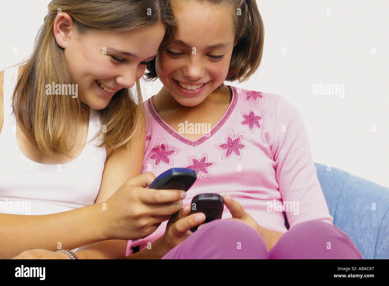 Teenage girls with mobile telephones Stock Photo - Alamy