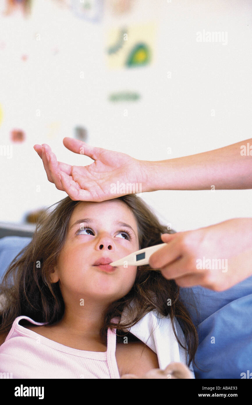 Girl with thermometer in mouth Stock Photo Alamy
