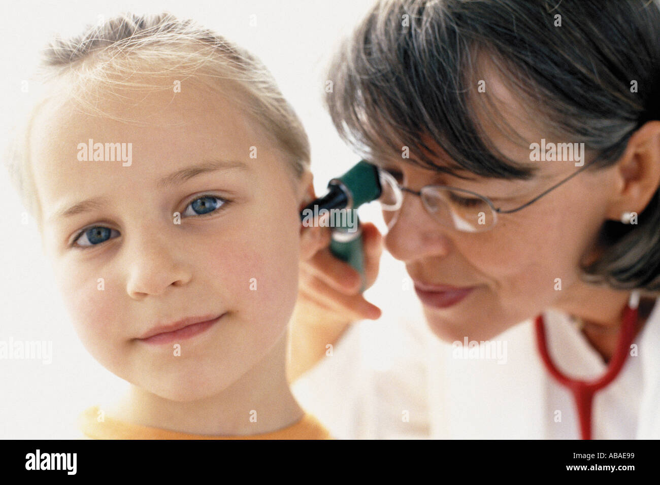 Girl being examined by doctor Stock Photo