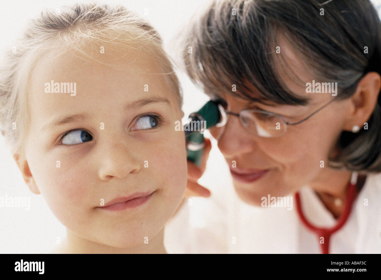 Girl being examined by doctor Stock Photo