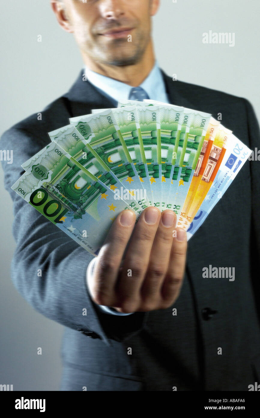 Man holding banknotes Stock Photo