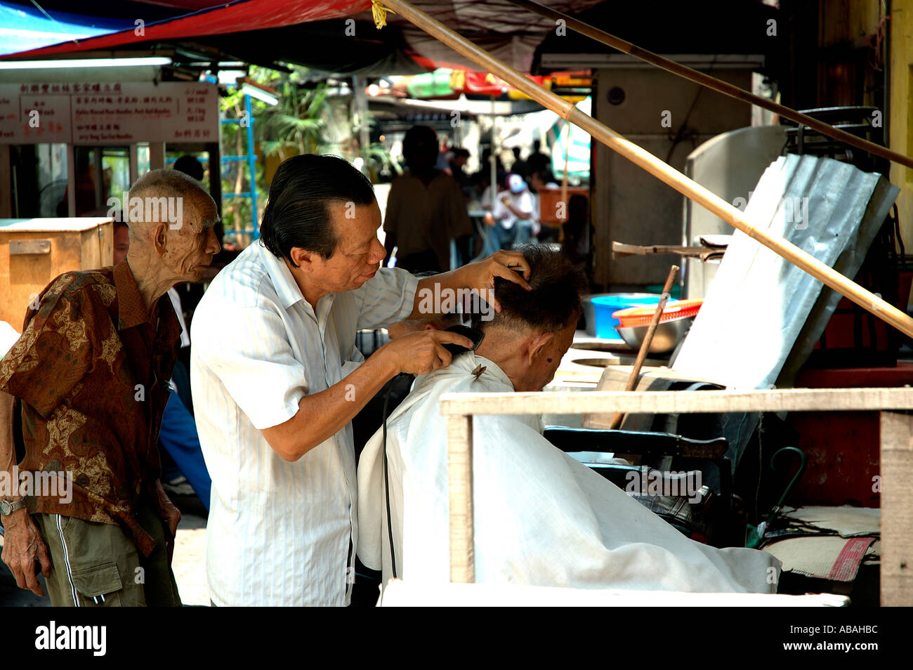 Open air barber shop in Petaling Street Malaysia Stock Photo Alamy